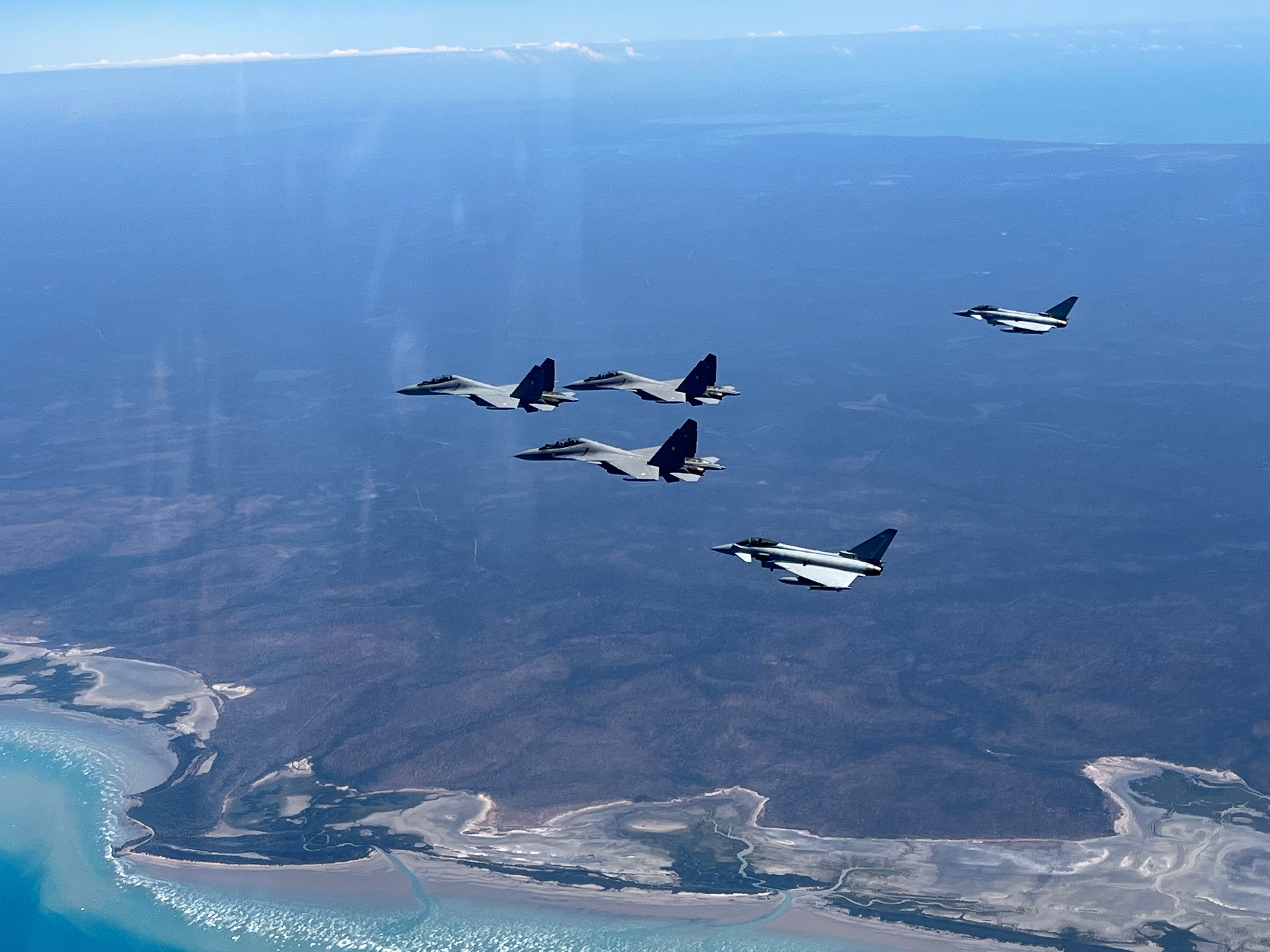 Image shows RAF Typhoons in formation as they fly.